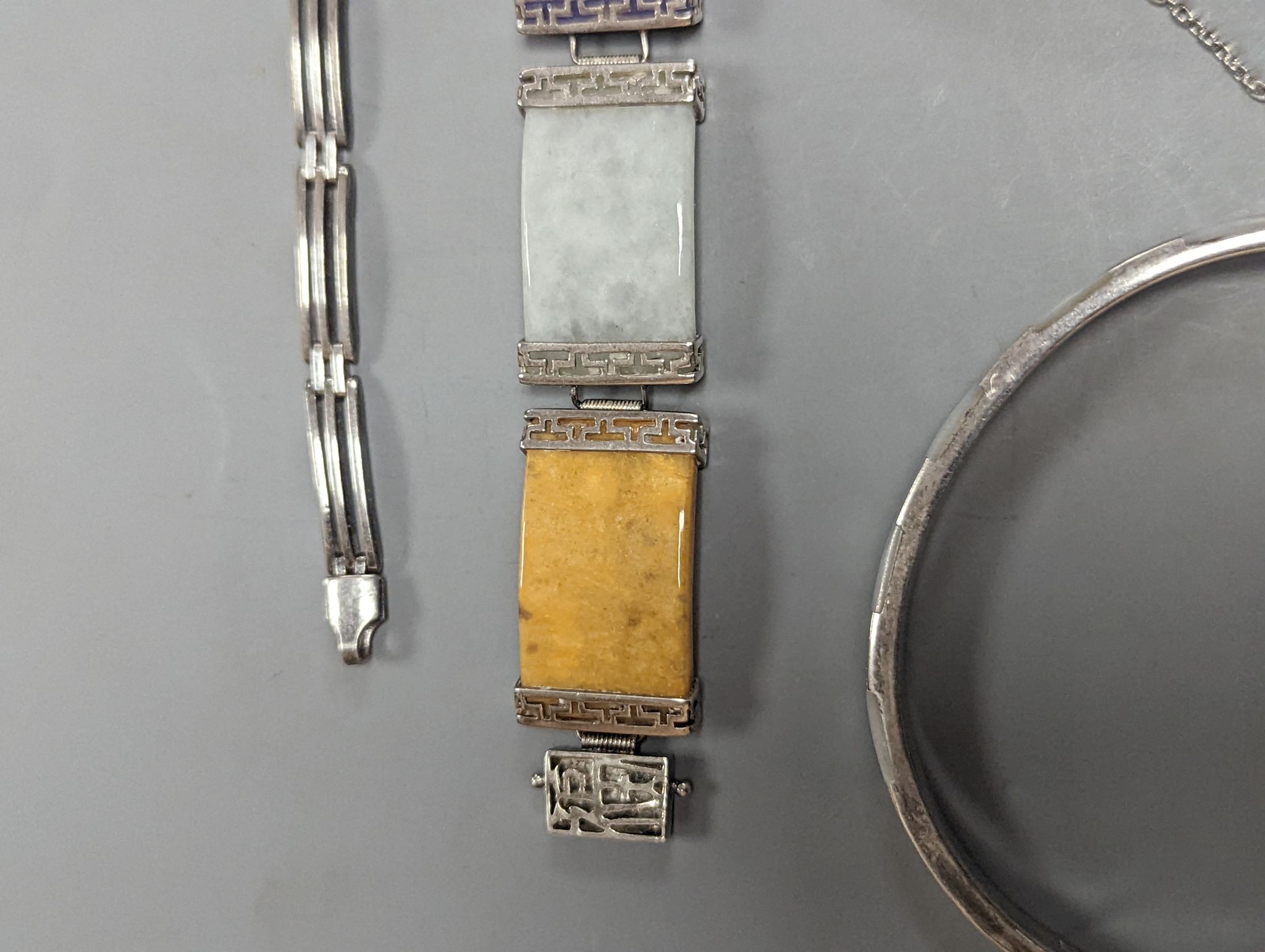 A 925 and hardstone set bracelet, 19.7cm, one other bracelet, two cameo shell brooches, three assorted bangles and a pair of sugar tongs.